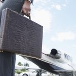 Businesswoman Holding a Briefcase --- Image by © Royalty-Free/Corbis